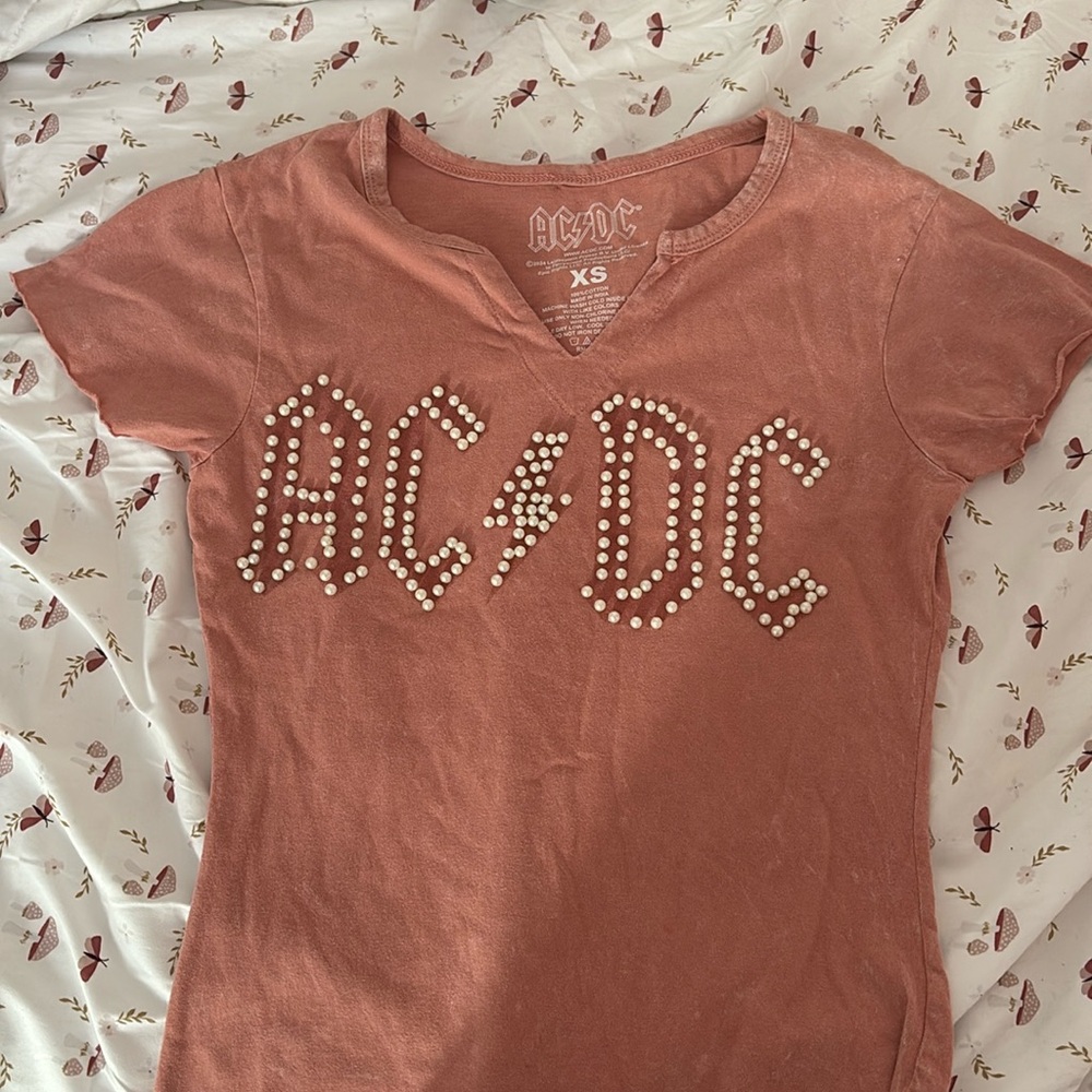 pink AC/DC top with faux pearls